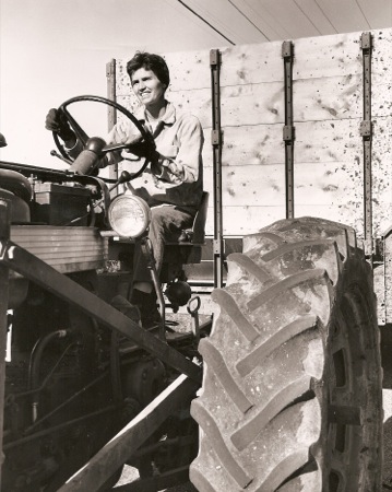 Anna driving a tractor.